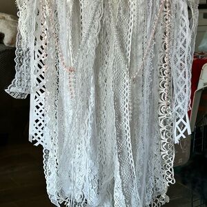 This is wall hanging.  Made out of lace, pearls, & birch branch.